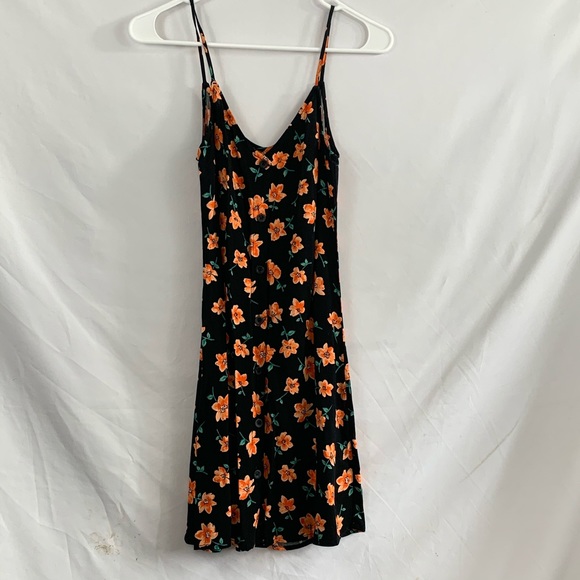 black dress orange flowers